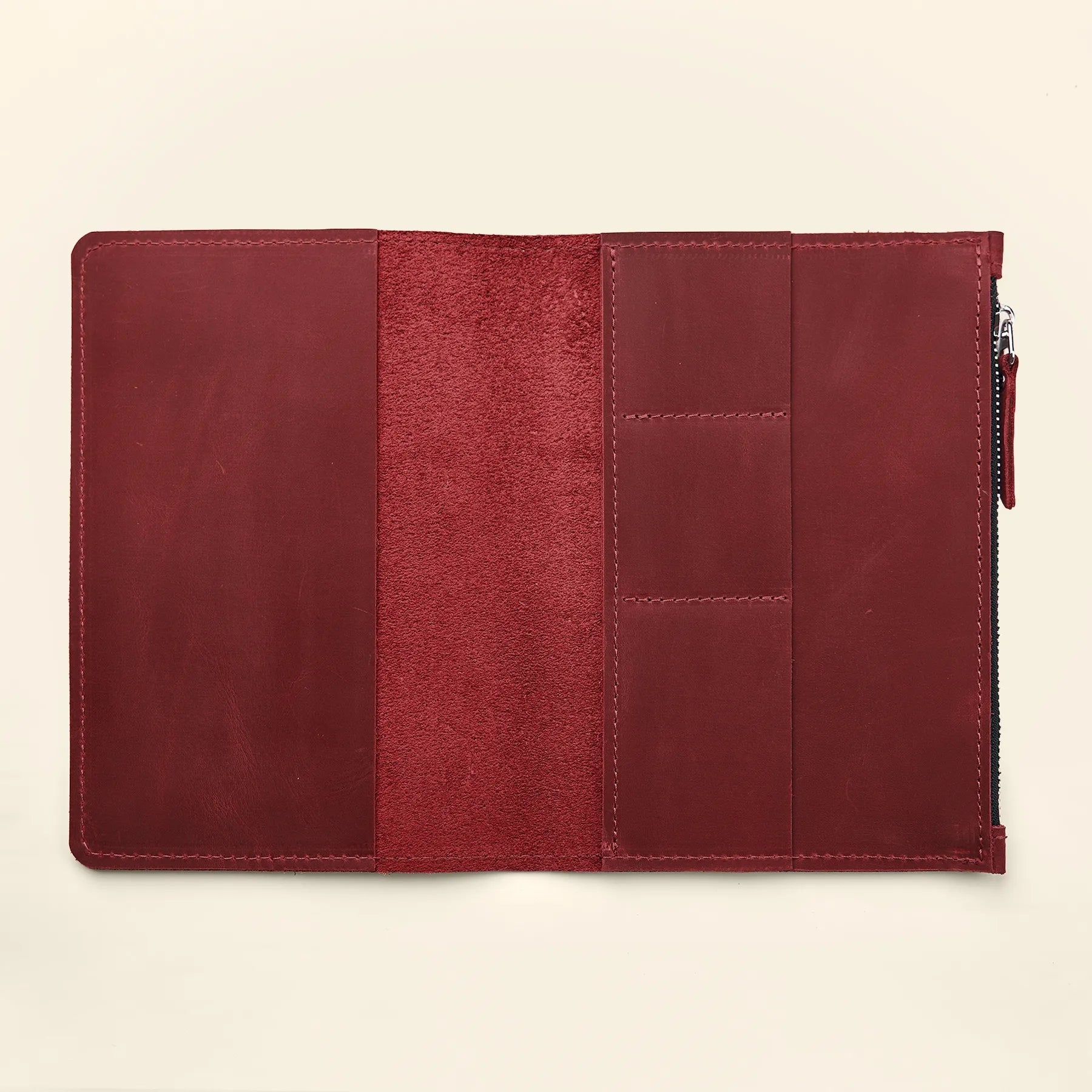 Leather organizer insert with multiple storage pockets for refillable notebook systems.