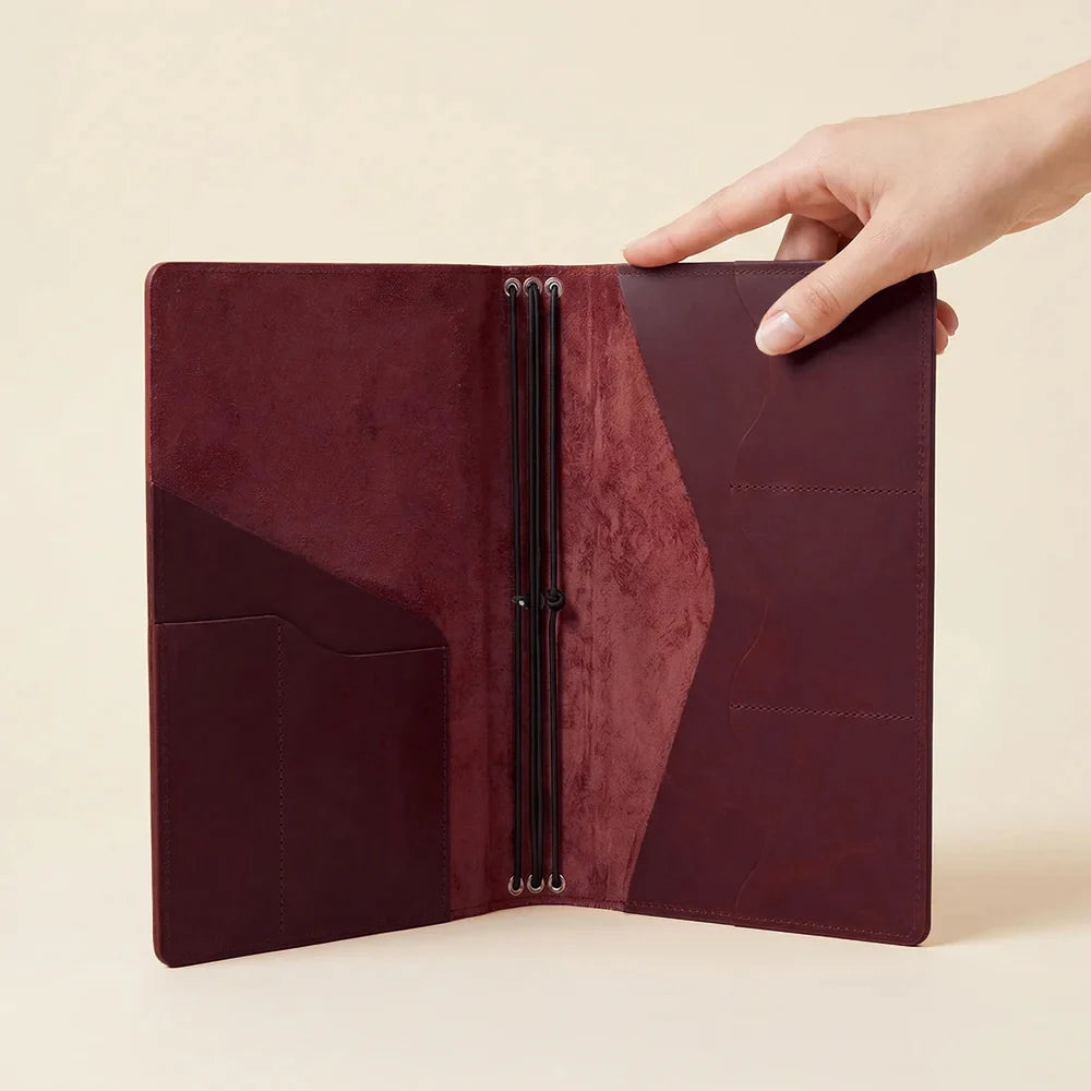 Genuine leather planner organizer with refillable notebook elastics and slim pocket design.