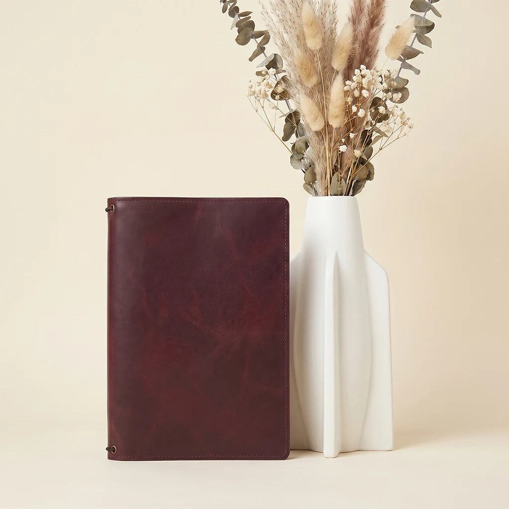 Handmade journal cover with secure elastic inserts and functional card pockets.