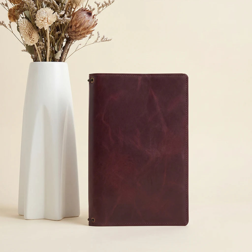 Leather journal cover showcasing handcrafted craftsmanship and practical storage options.