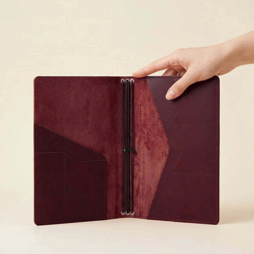 Elegant leather notebook cover with three elastic notebook loops and card storage pockets.