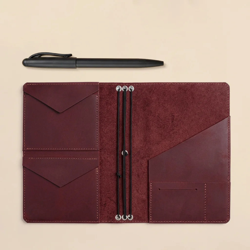 Genuine leather notebook organizer with handcrafted pockets and refillable elastic band system.