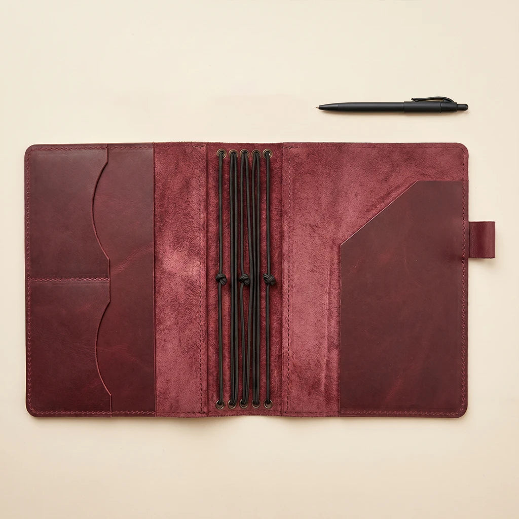 Handmade leather notebook holder with refillable layout and organizer pockets