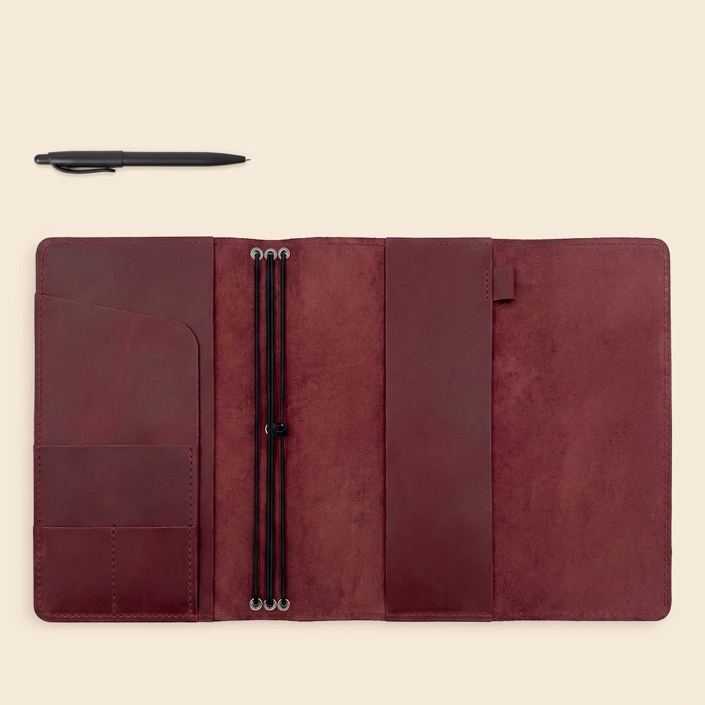 Full grain leather notebook cover featuring smart interior storage and notebook retention bands.