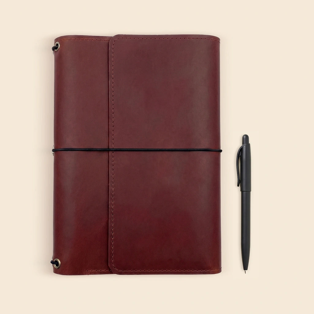 Premium leather notebook holder with handcrafted quality and refillable journal insert system.