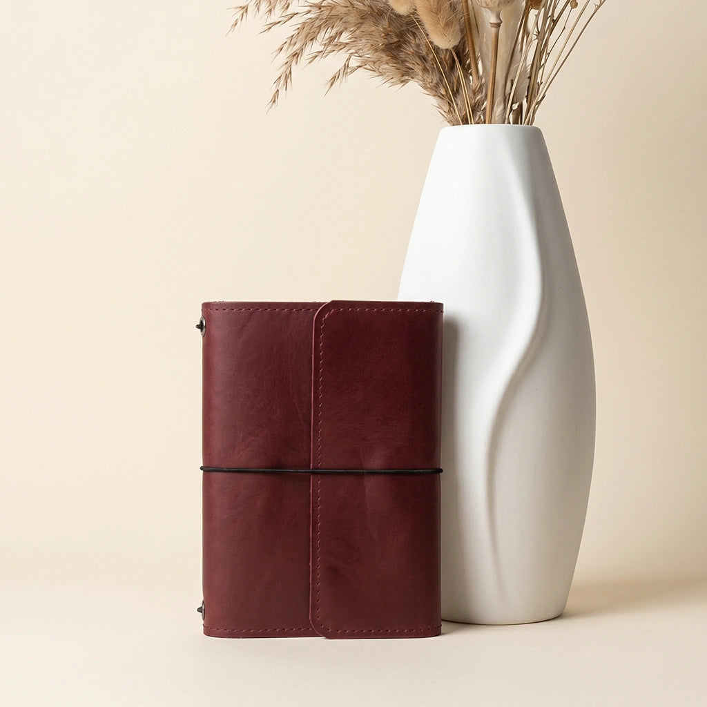 Leather writing journal cover with handcrafted finish and durable elastic notebook bands.