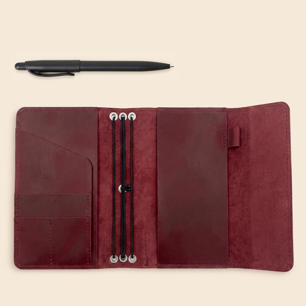 Premium leather notebook cover combining elegant craftsmanship with practical storage features.