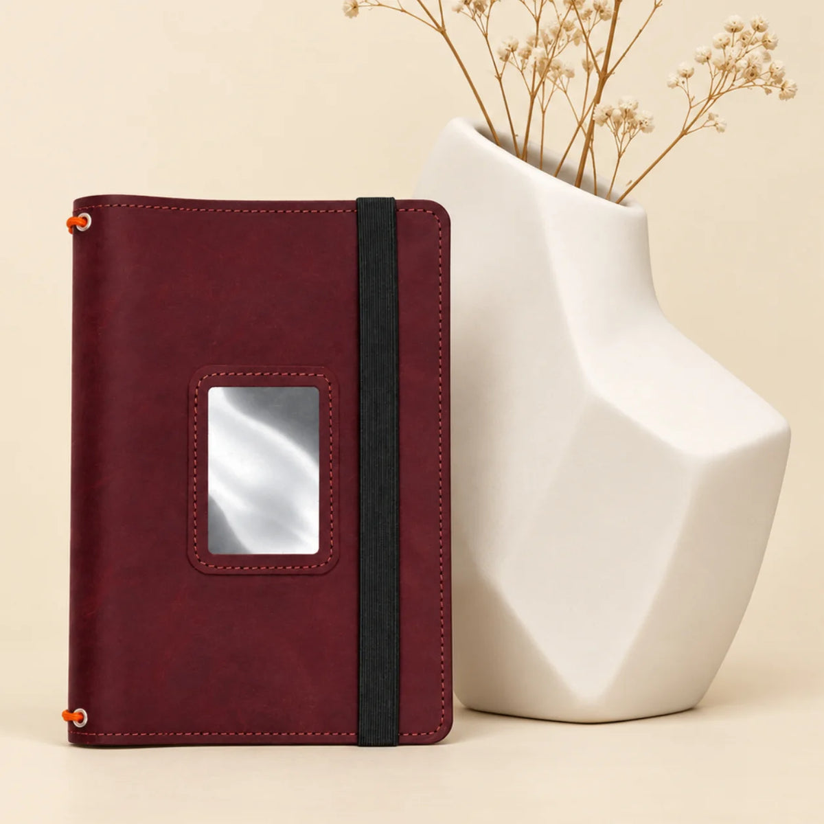 Natural leather journal organizer showing three flexible bands and practical pockets inside the cover.