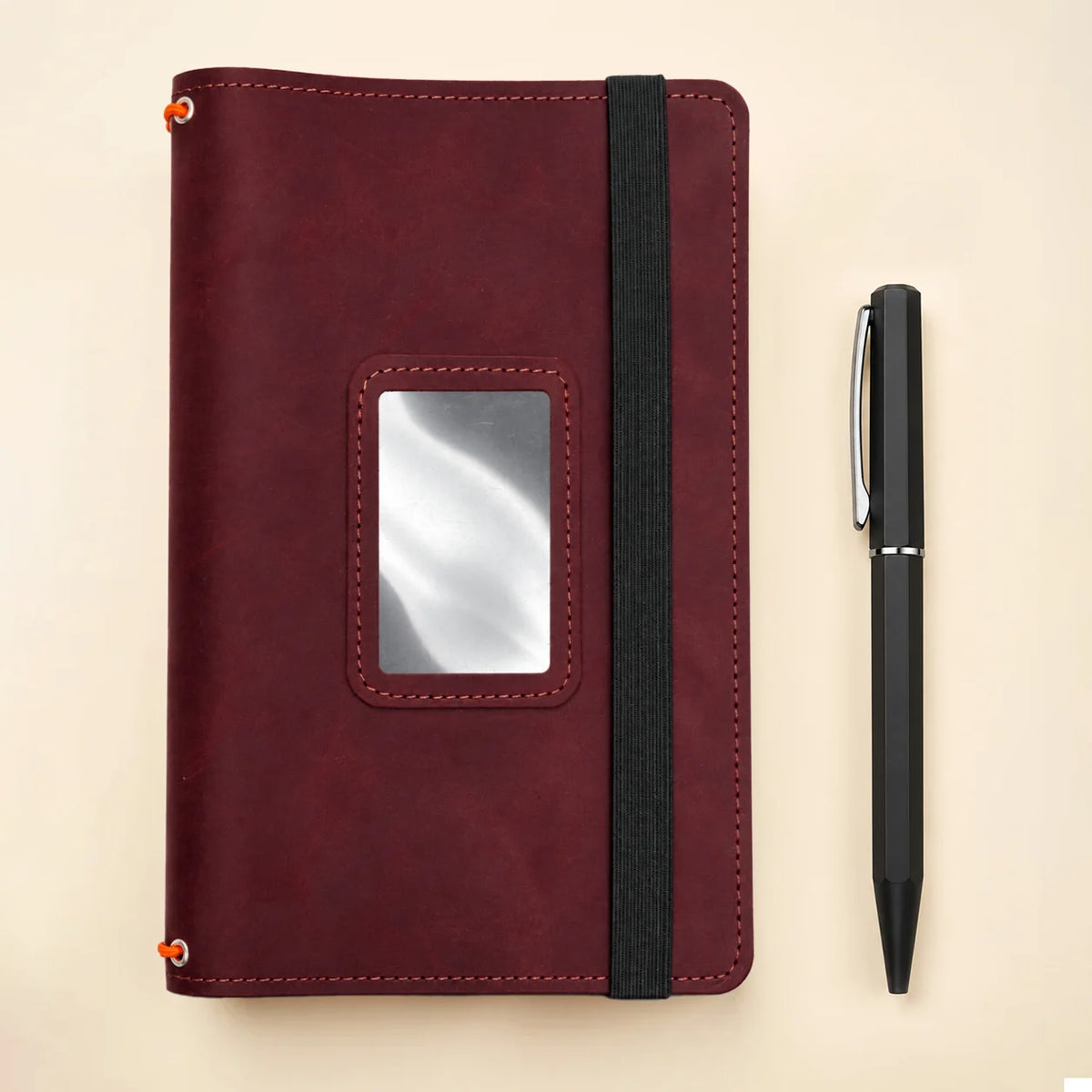 Handmade journal cover crafted from leather with three bands and convenient inner compartments.