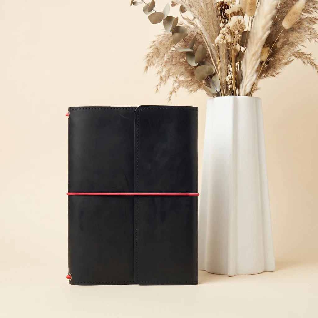 Rustic leather notebook cover with elastic closure and durable handmade construction