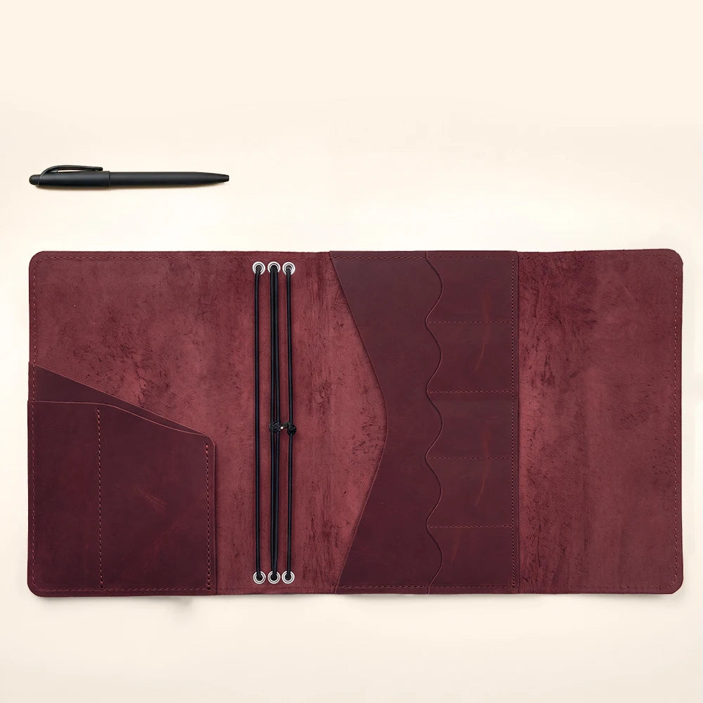 Genuine leather planner sleeve crafted for refillable notebooks and organized daily essentials.
