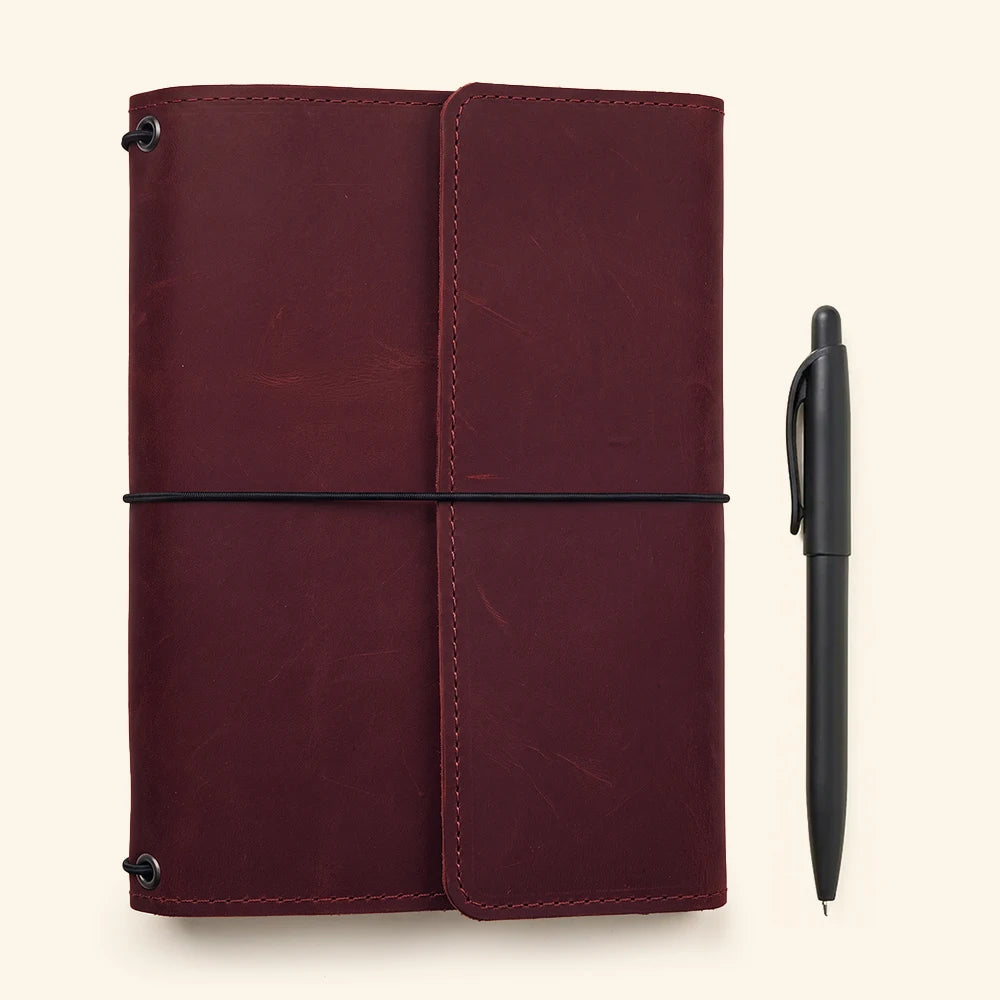 Premium leather notebook protector featuring organized interior layout and refillable notebook inserts.