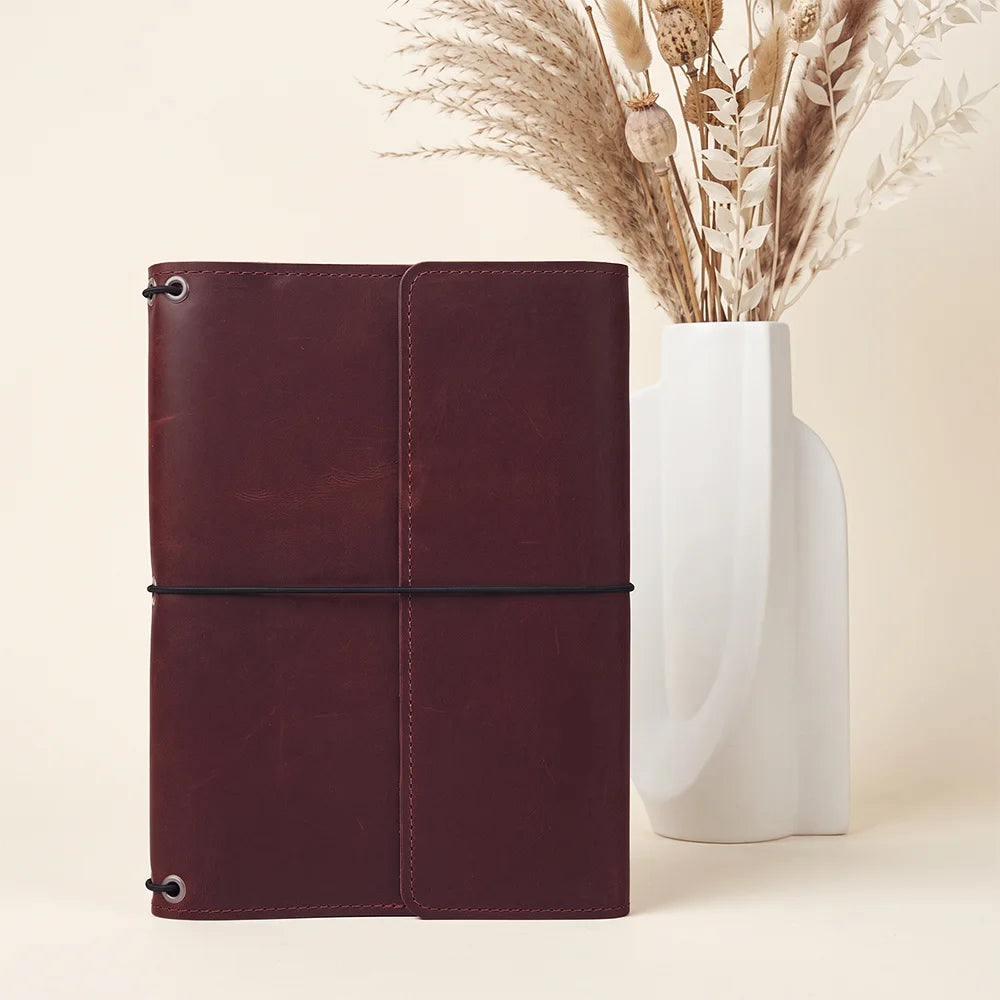Durable leather notebook portfolio featuring organized compartments and three strong elastic notebook bands.