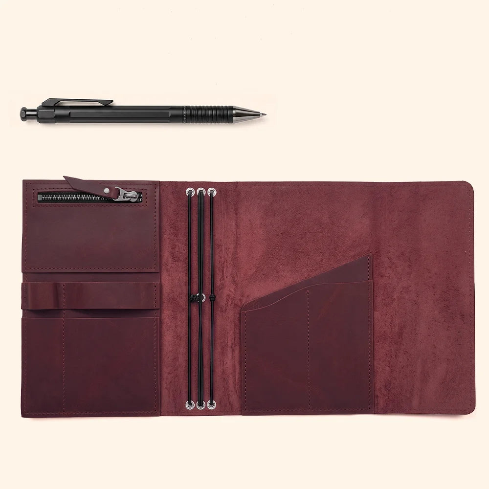 Genuine leather notebook case designed with spacious pockets and an integrated pen loop.