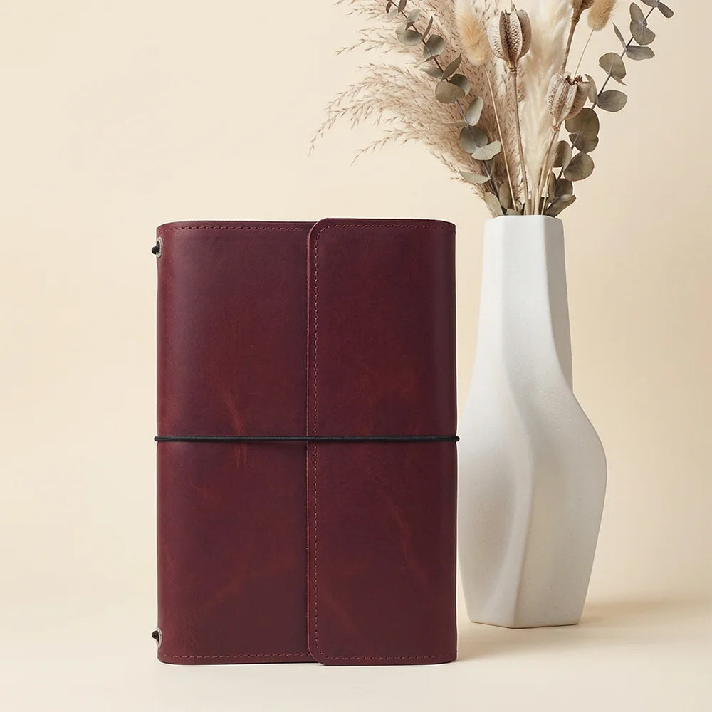 Natural leather journal cover showing useful compartments and dedicated pen storage space