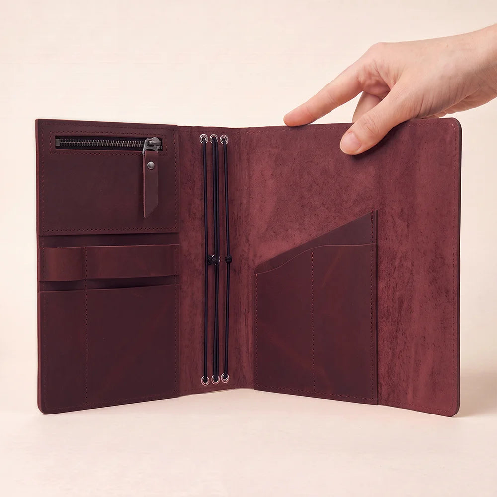 Handmade genuine leather notebook cover with organized pockets and a practical pen holder