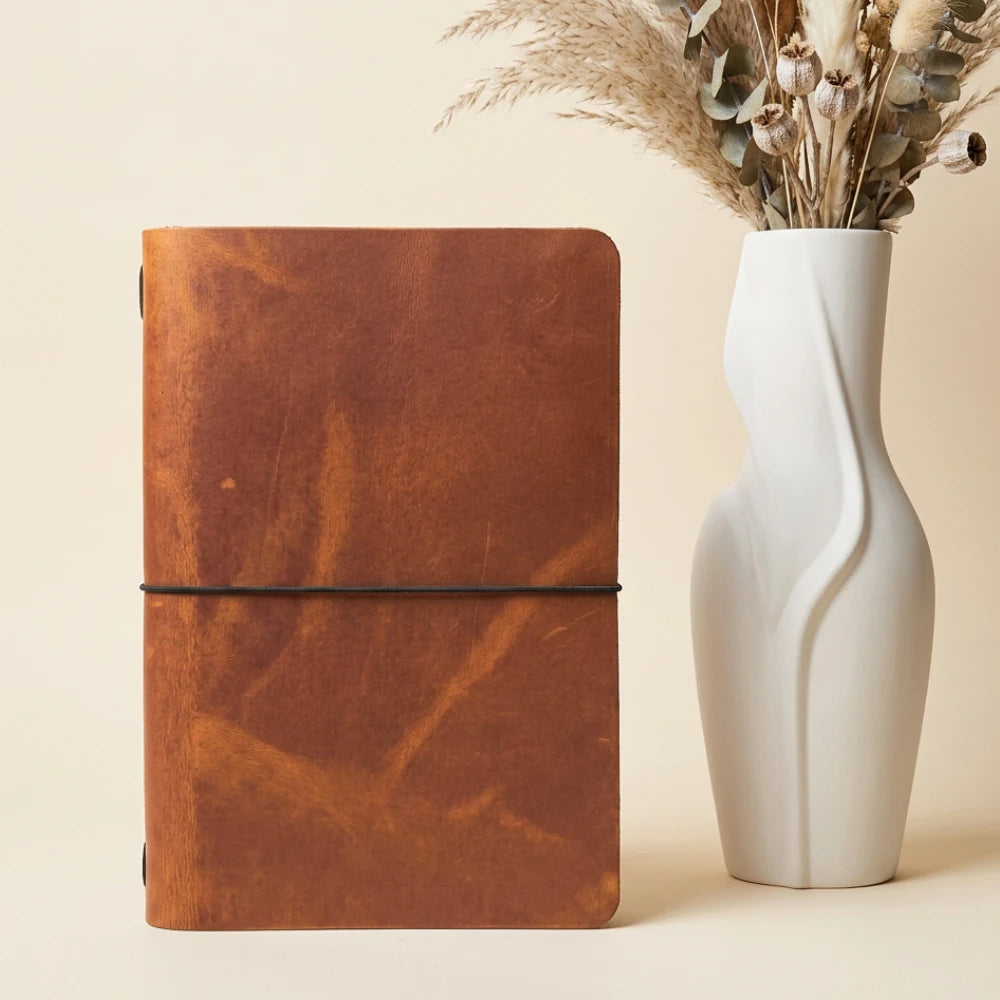 Genuine leather notebook wrap offering a classic appearance and practical everyday function.