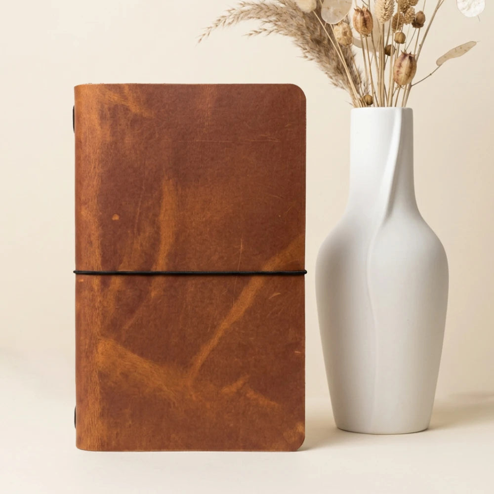Compact leather writing cover designed for convenient journaling at home or travel.