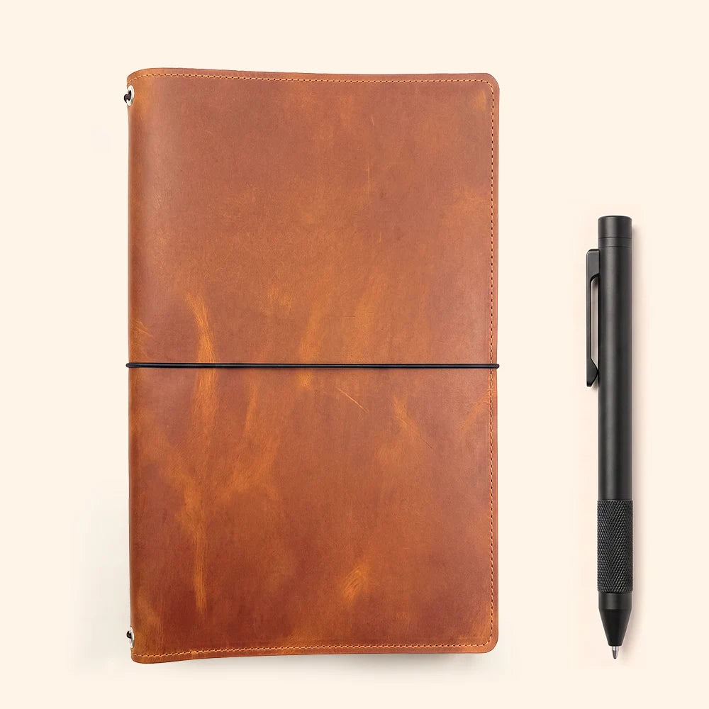 Genuine leather journal organizer featuring flexible cords for switching notebook inserts easily.