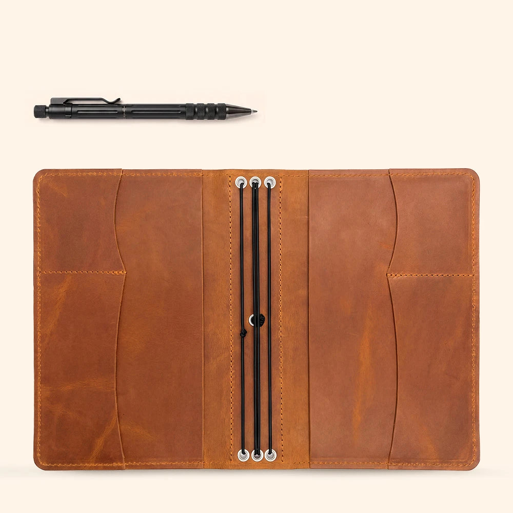 Refillable leather writing cover with handcrafted organization and dedicated pen storage.