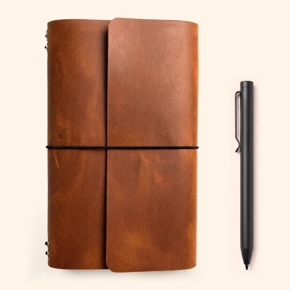 Natural leather notebook folio designed to hold six interchangeable writing booklets.