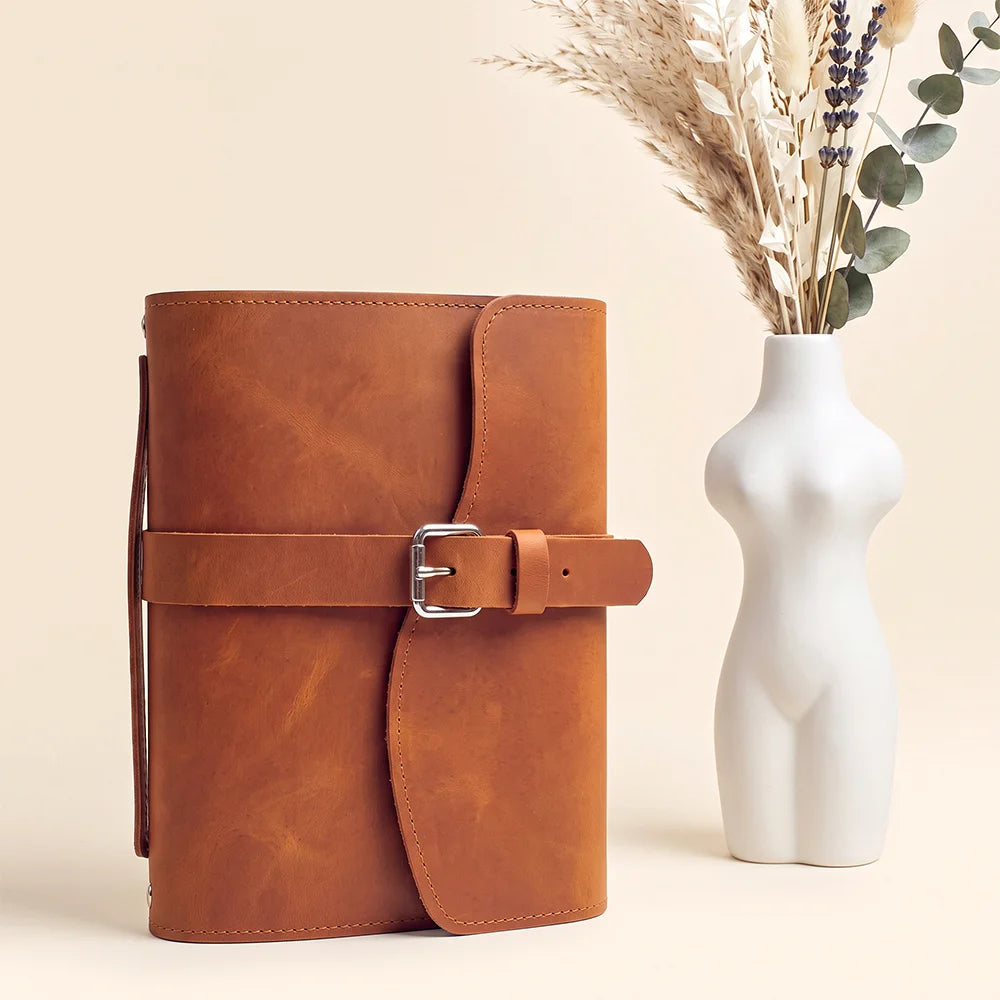 Handmade genuine leather notebook organizer with pockets, pen loop, bookmark, and functional external carrying handle.