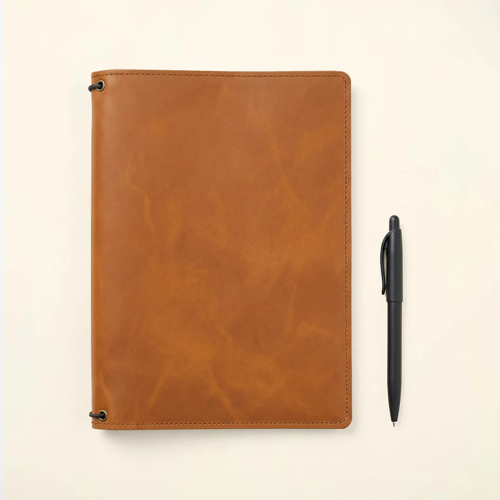 Leather notebook cover highlighting durable materials and organized interior details.