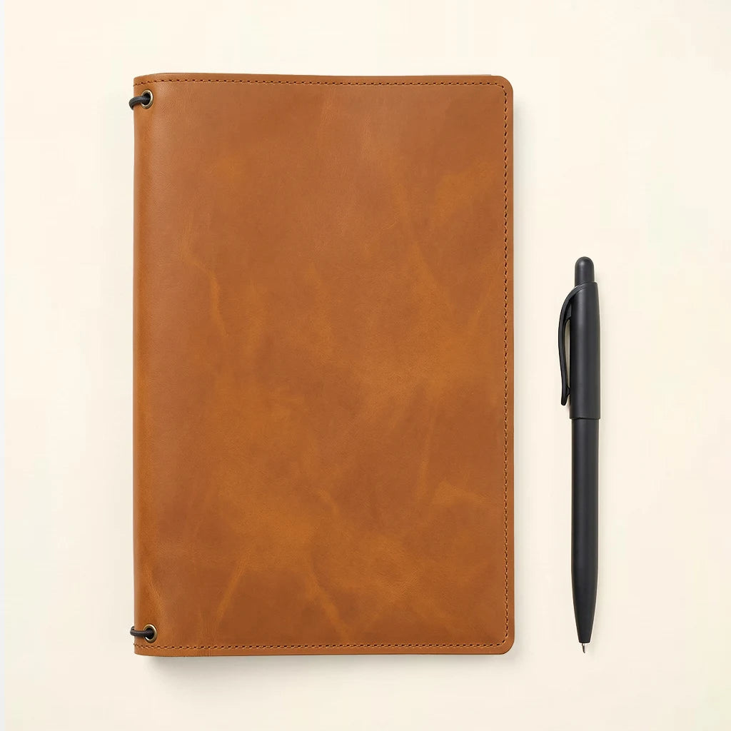 Leather writing companion with spacious interior and secure elastic fasteners.