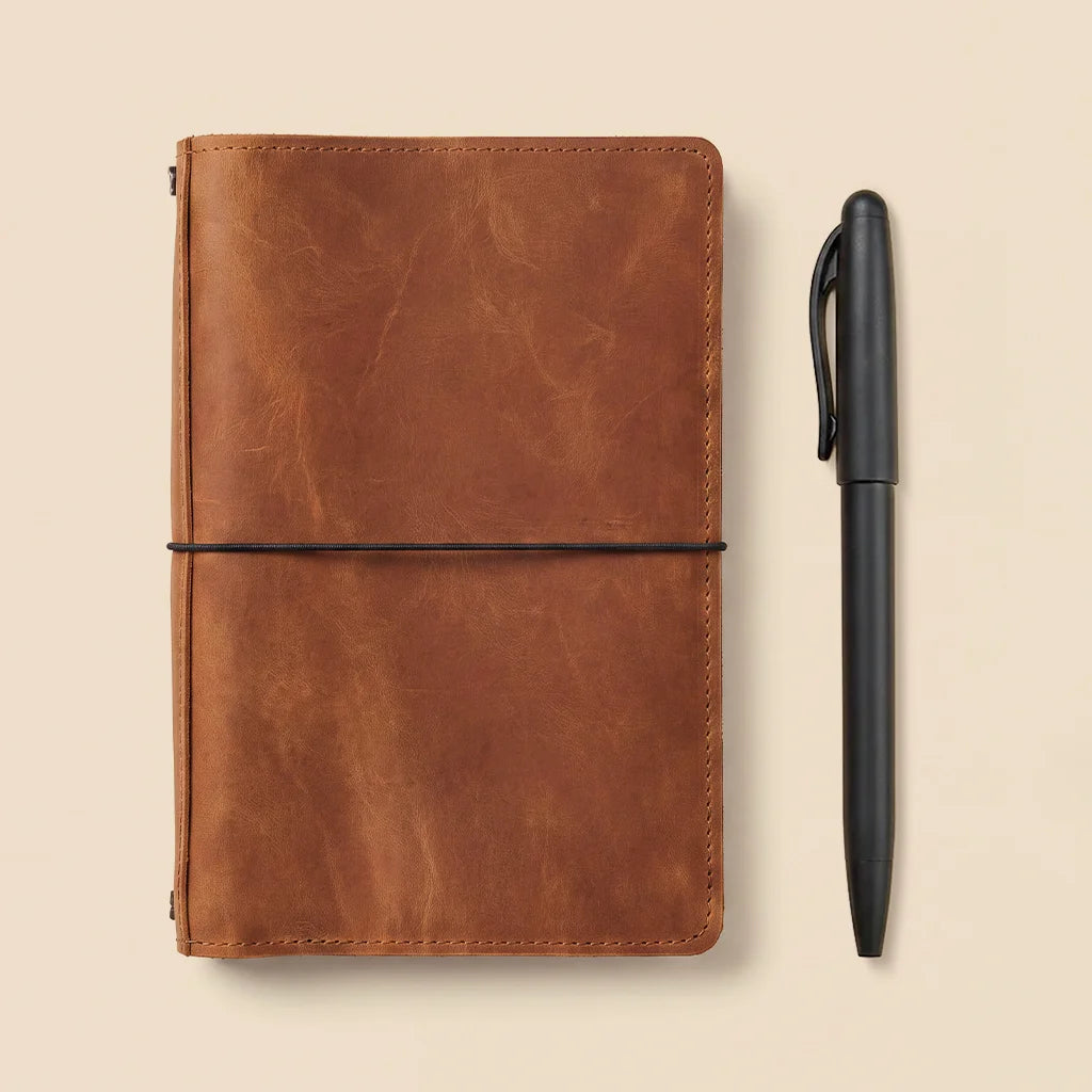 Elegant leather notebook organizer with interior card pockets and multiple elastic insert holders.