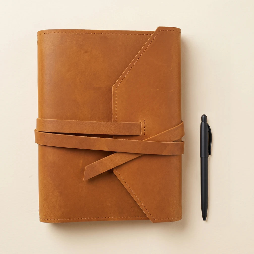 Stylish journal cover made from genuine leather with built-in pen loop.