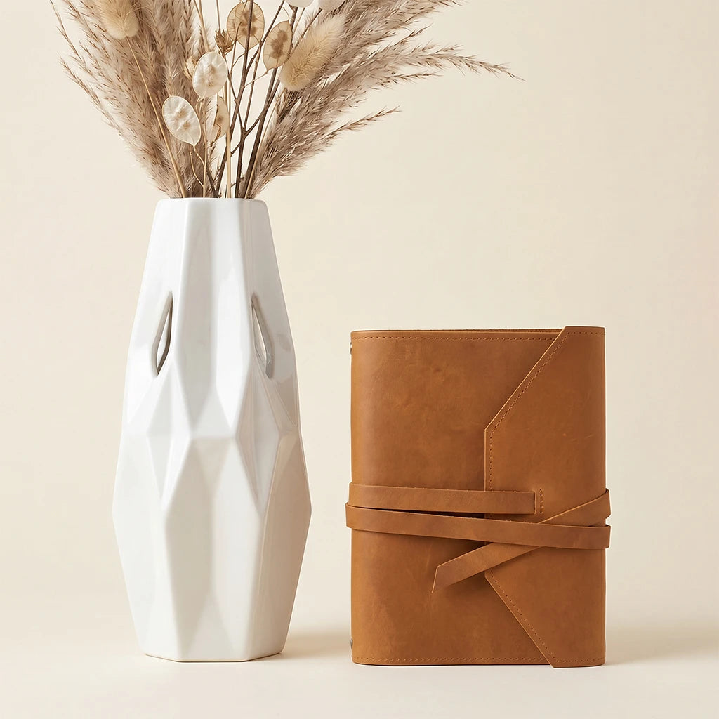 Genuine leather refillable notebook cover with organized pen loop and elastic bands.