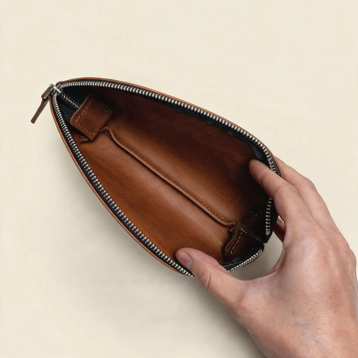 Elegant genuine leather toiletry pouch secured with a practical zipper closure