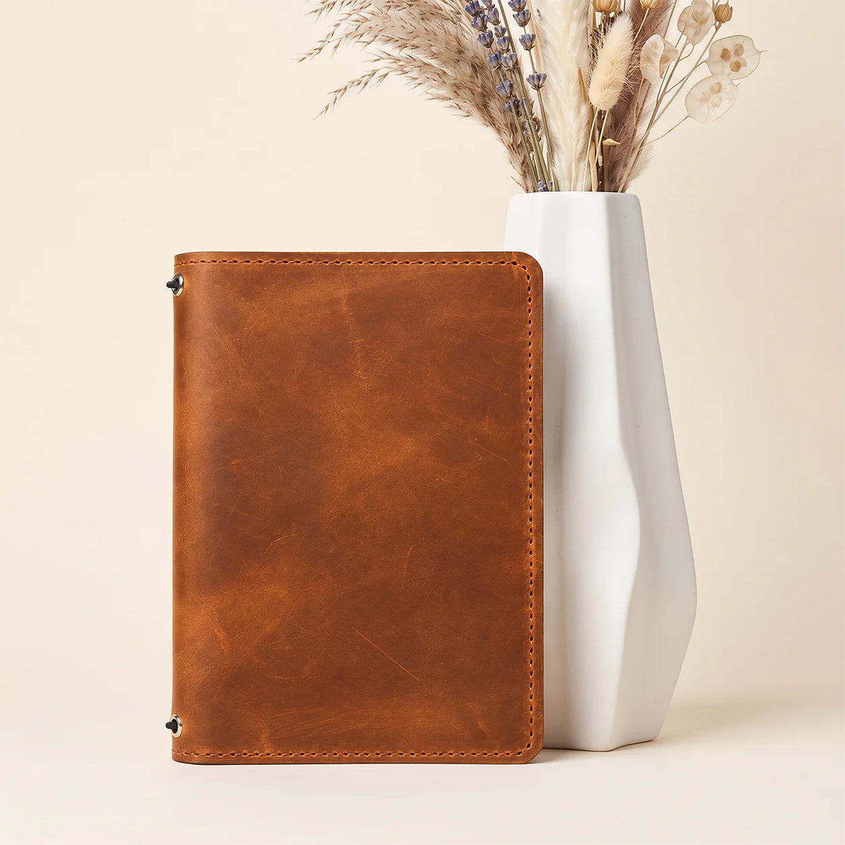 Handmade natural leather notebook cover with durable construction and organized pockets
