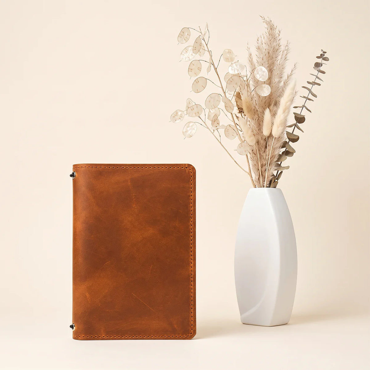 Handmade first grade leather cover with practical pockets and two elastic closures