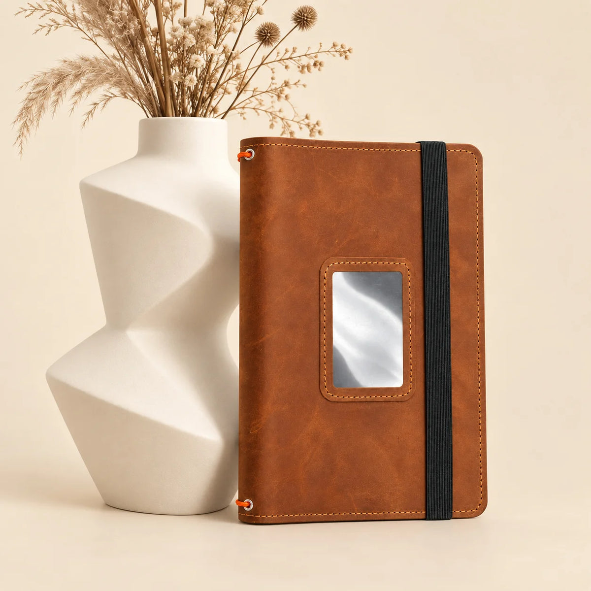 Leather notebook cover made from genuine leather with three bands and useful pockets.