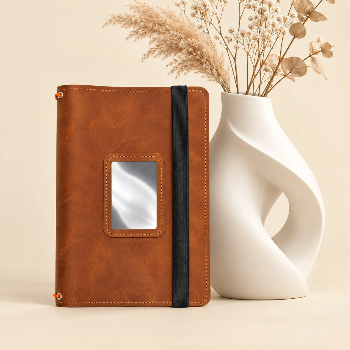 Genuine leather journal cover featuring three elastic bands and practical interior pockets.