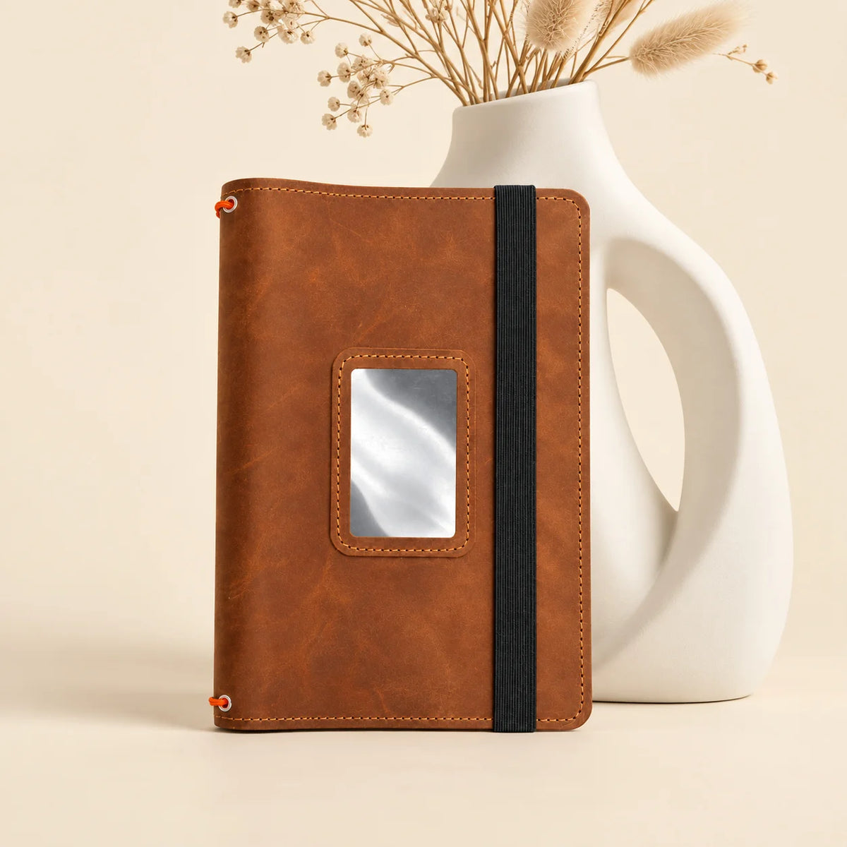 Handmade natural leather journal cover with three elastic bands and useful inner pockets.