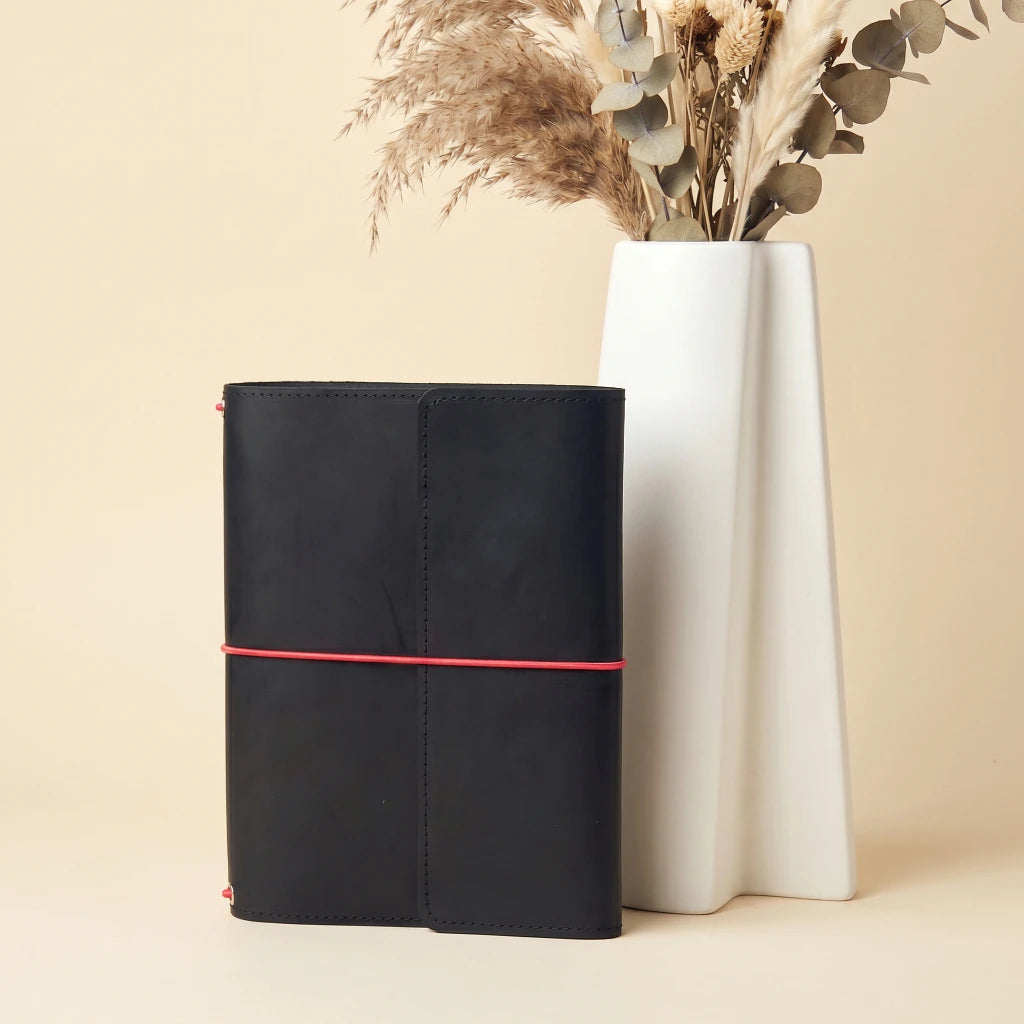 Leather travel journal holder with elastic closure and integrated pen storage loop
