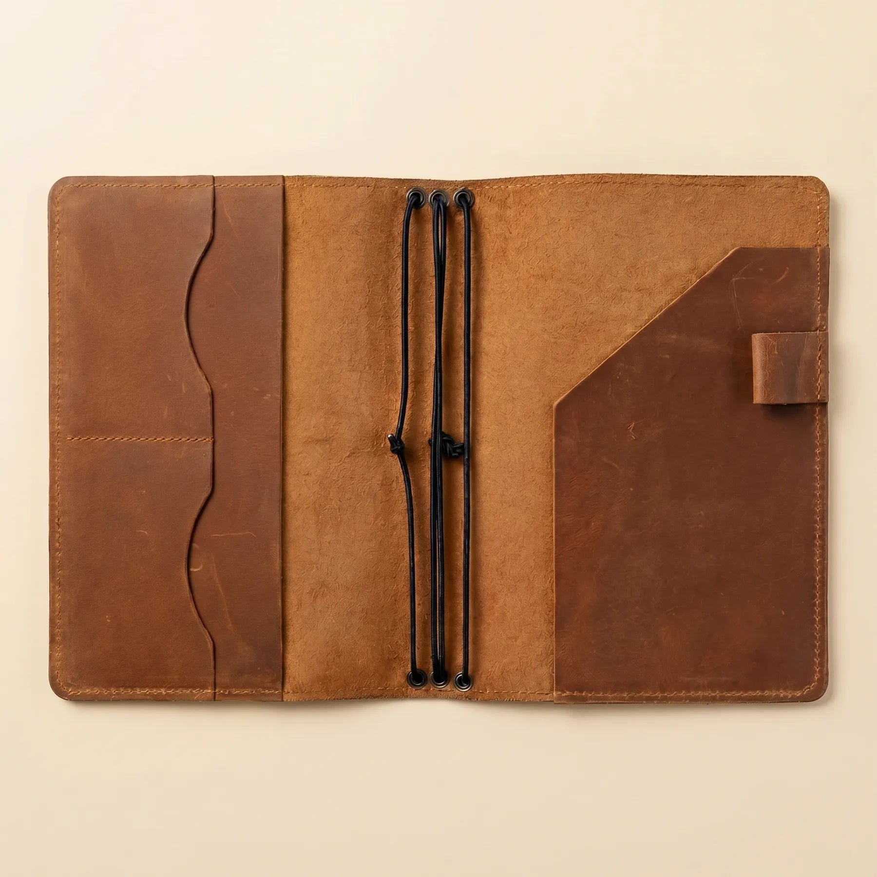 Full grain leather notebook organizer featuring refillable inserts and handcrafted quality.