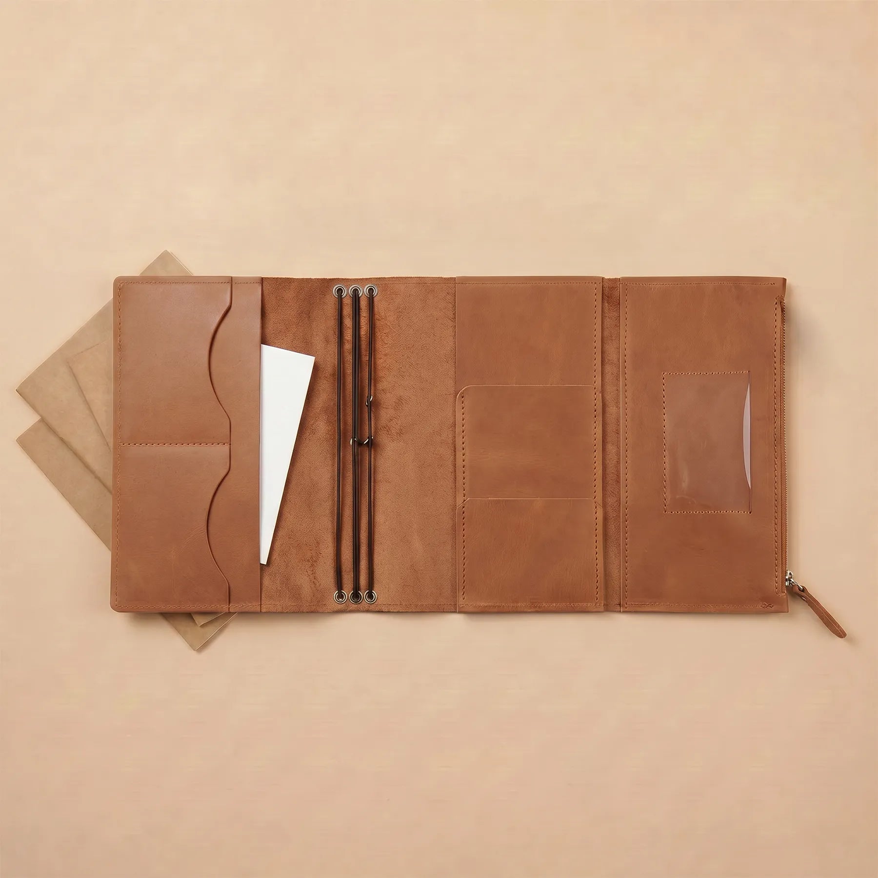 Leather journal cover featuring premium leather construction and refillable notebook inserts.