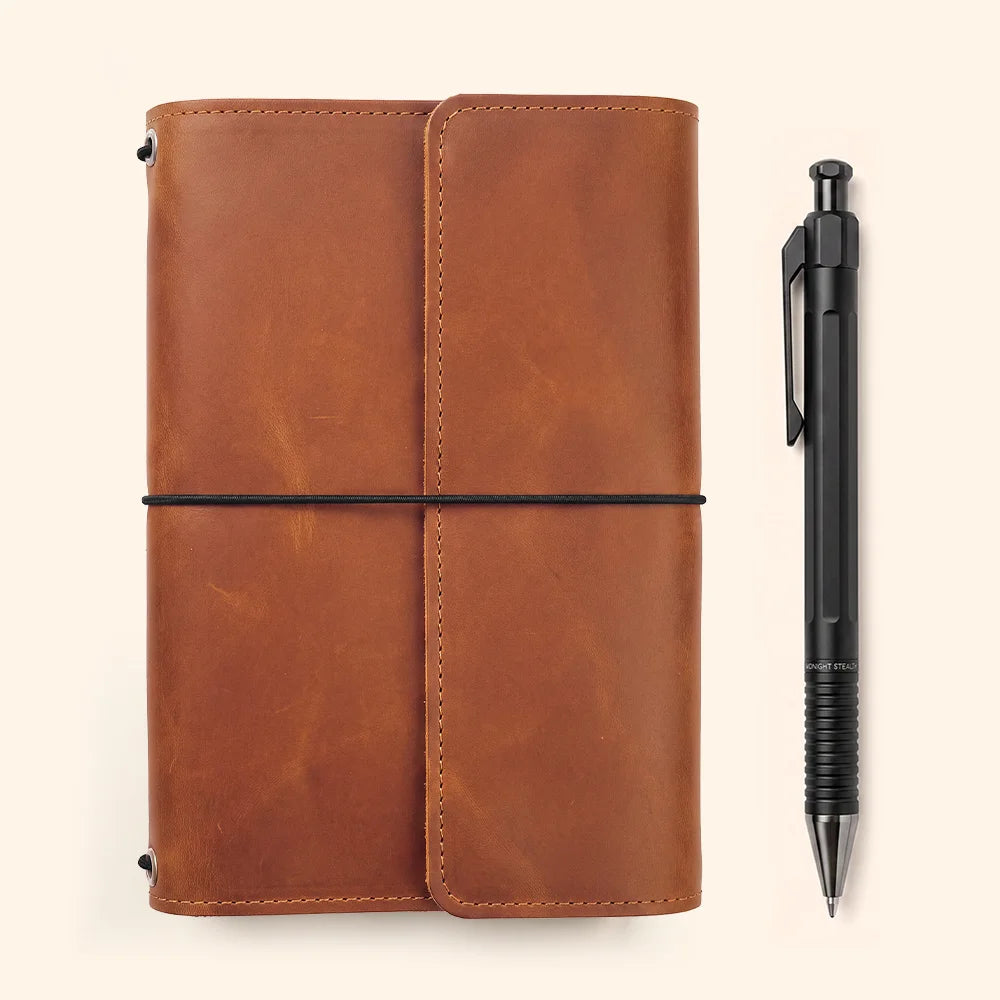 Handcrafted natural leather journal cover containing several useful compartments and pen accommodation.