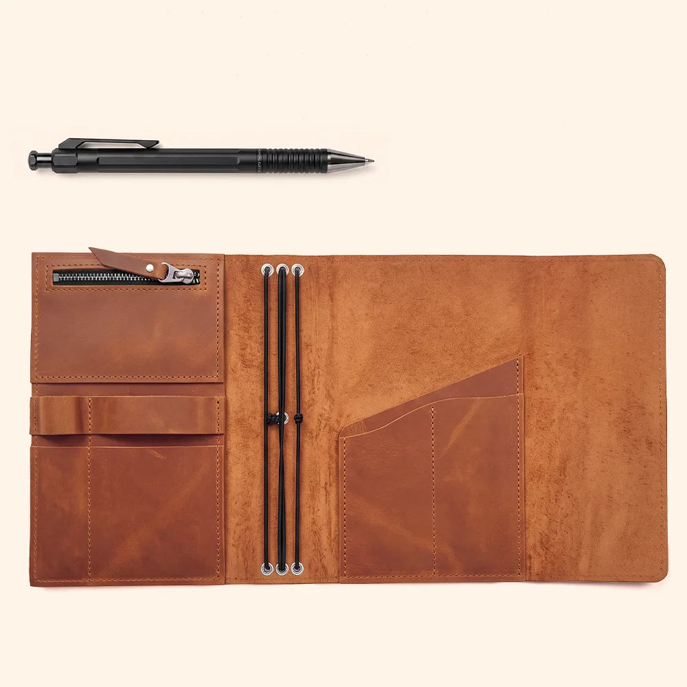 Premium natural leather notebook cover featuring organized pockets and dedicated pen storage