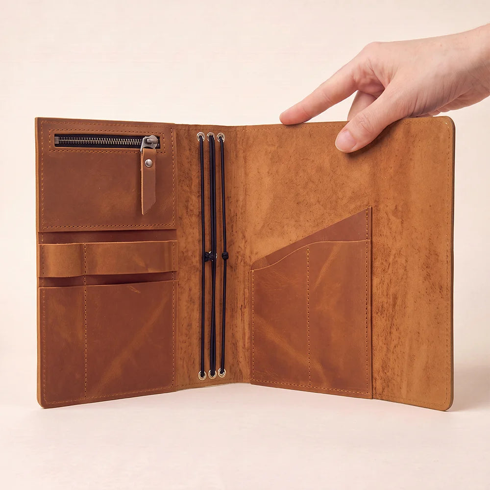 Premium leather notebook cover showing interior pockets and a convenient pen holder