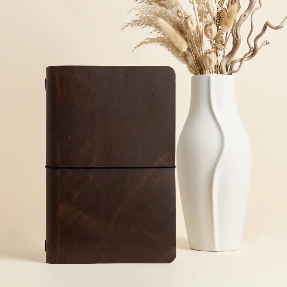 Handmade writing cover combining natural leather character with a clean notebook design.
