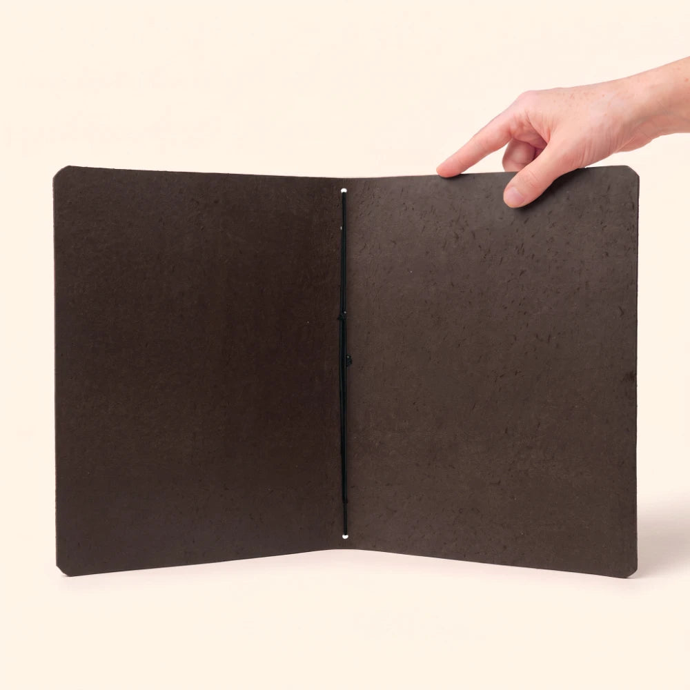 Genuine leather journal wrap built for portable writing, planning, and personal reflections.
