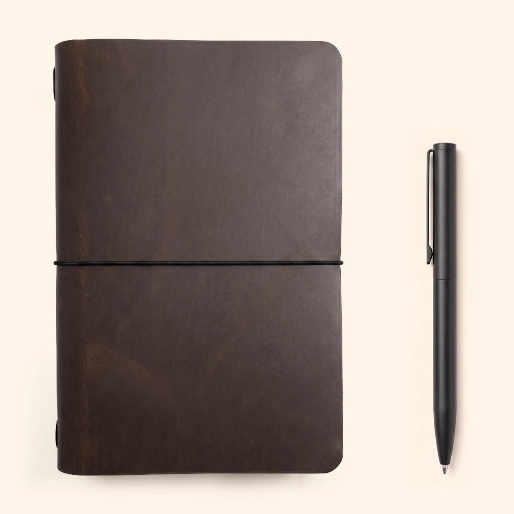 Leather notebook sleeve with a basic insert and carefully finished handcrafted details.