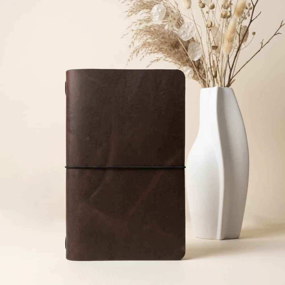Slim handmade writing cover designed to keep a notebook comfortably secured in place.