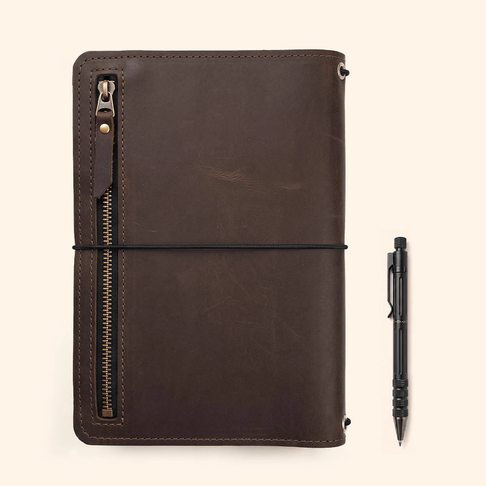 Leather notebook protector with spacious compartments for papers, receipts, and writing accessories.
