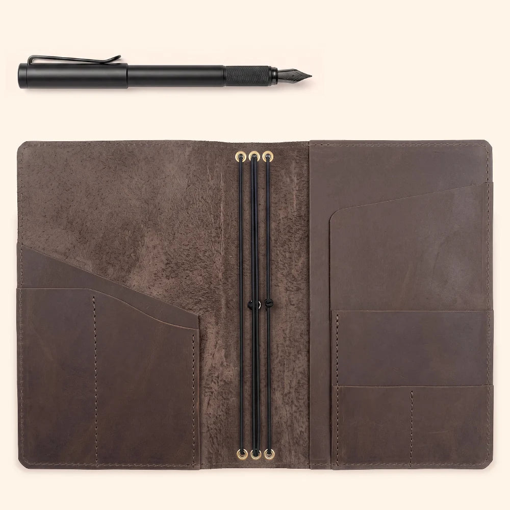 Handmade natural leather planner cover with three interior elastic holders.