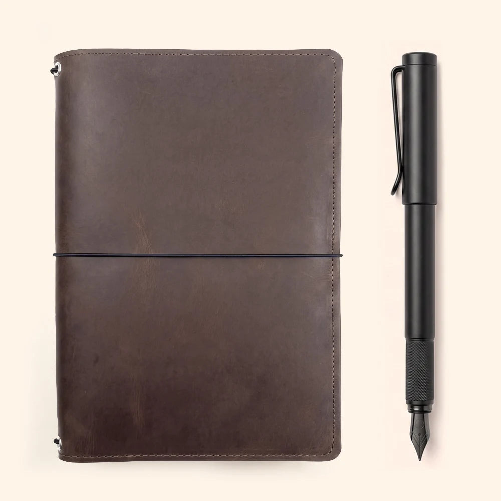 Refillable journal holder made from natural leather with three interior elastic loops.
